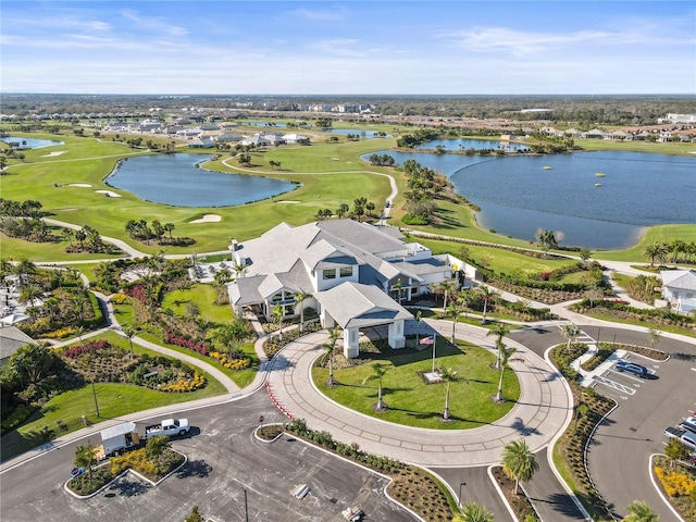 bird's eye view with a water view and view of golf course