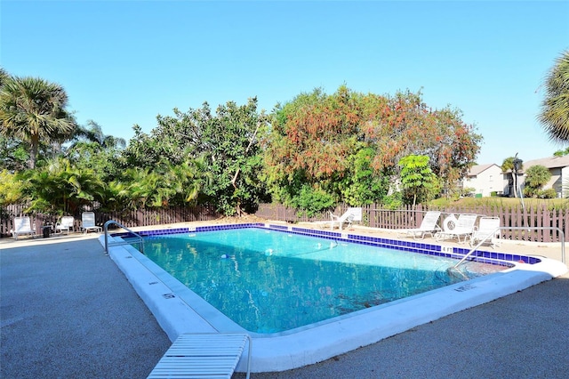 view of swimming pool with a patio area