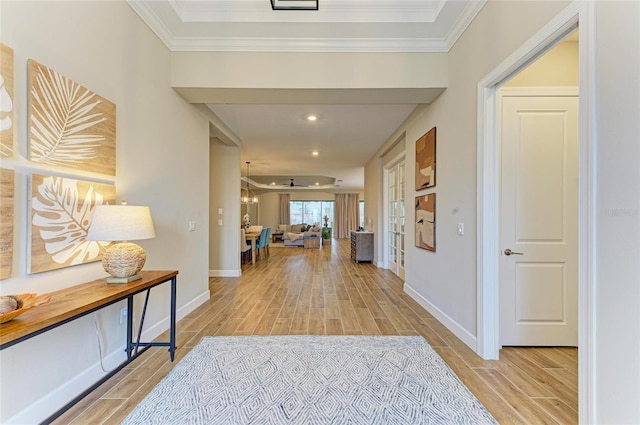 hall with wood tiled floor, baseboards, crown molding, and recessed lighting