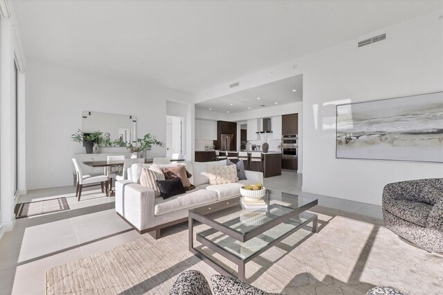 living room with light tile patterned floors