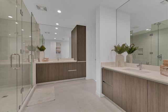 bathroom with vanity and an enclosed shower