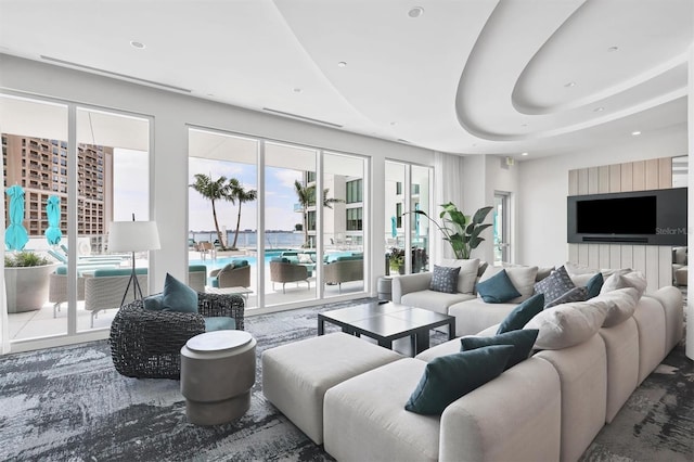 living room featuring a raised ceiling