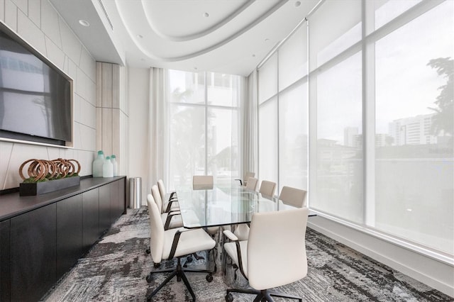 dining room featuring plenty of natural light and floor to ceiling windows