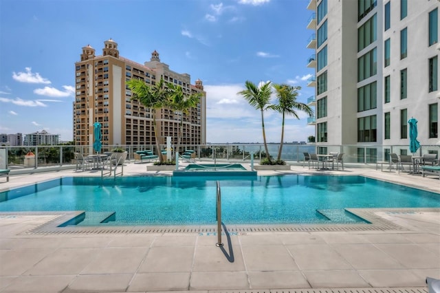 view of swimming pool featuring a patio area