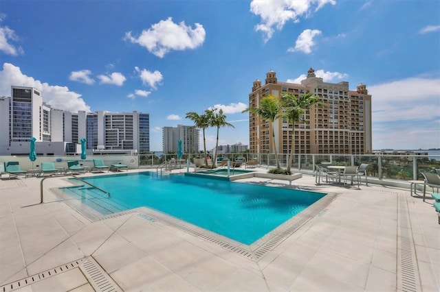 view of swimming pool with a patio