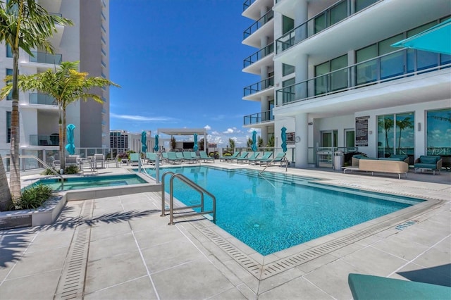 view of swimming pool with a patio