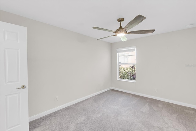 empty room featuring ceiling fan and carpet floors