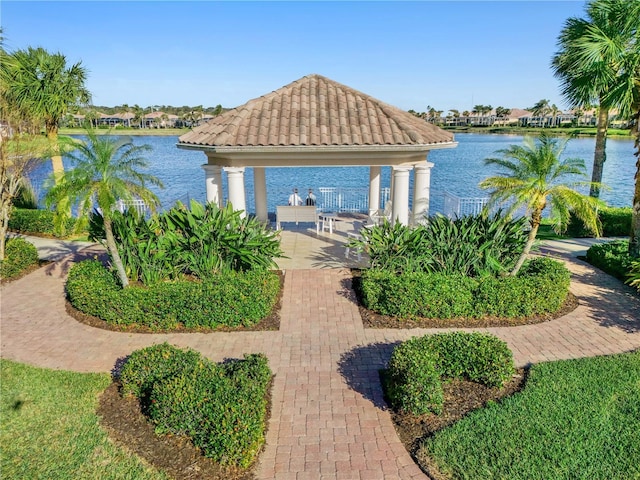 view of property's community featuring a gazebo and a water view