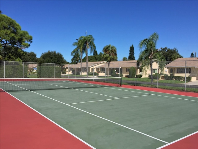 view of tennis court featuring basketball court