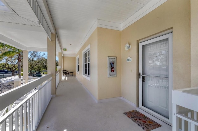 doorway to property with stucco siding