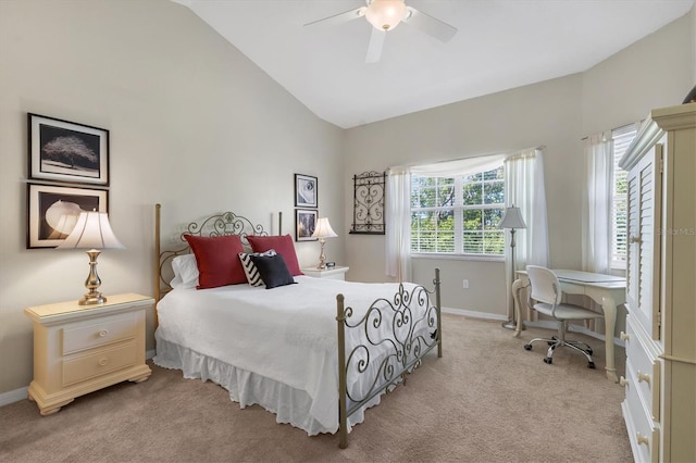 bedroom featuring baseboards, lofted ceiling, light colored carpet, and ceiling fan