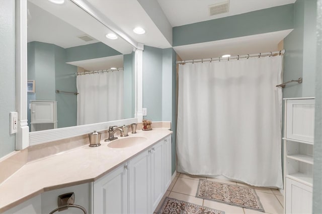 full bath with vanity, tile patterned floors, and visible vents