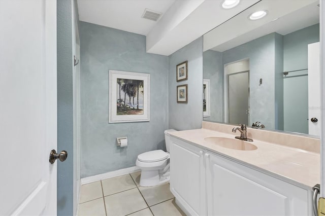 bathroom featuring vanity, baseboards, visible vents, tile patterned floors, and toilet