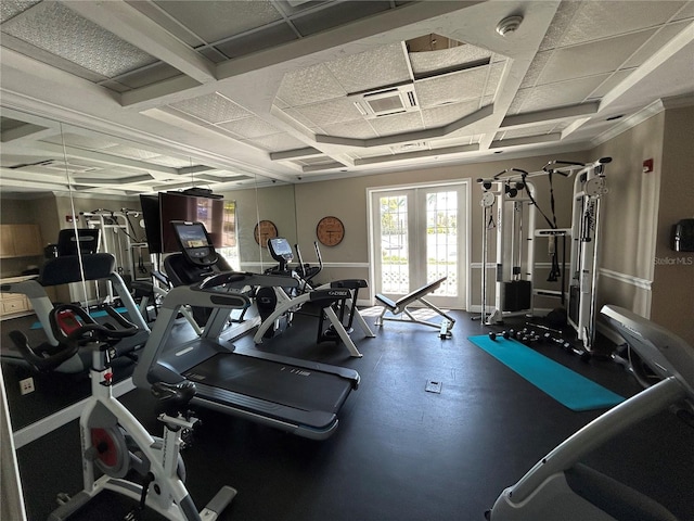 workout area featuring visible vents and coffered ceiling