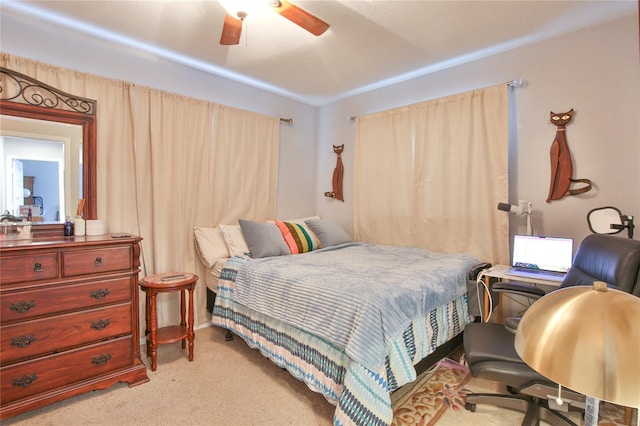 bedroom featuring ceiling fan and light colored carpet