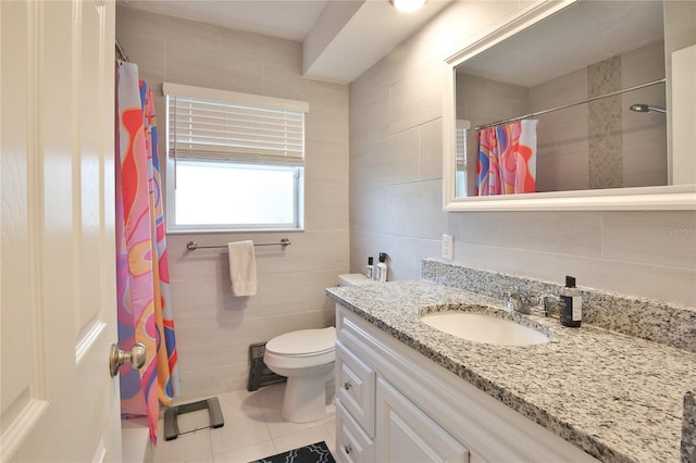 bathroom with toilet, a shower with shower curtain, tile walls, and vanity