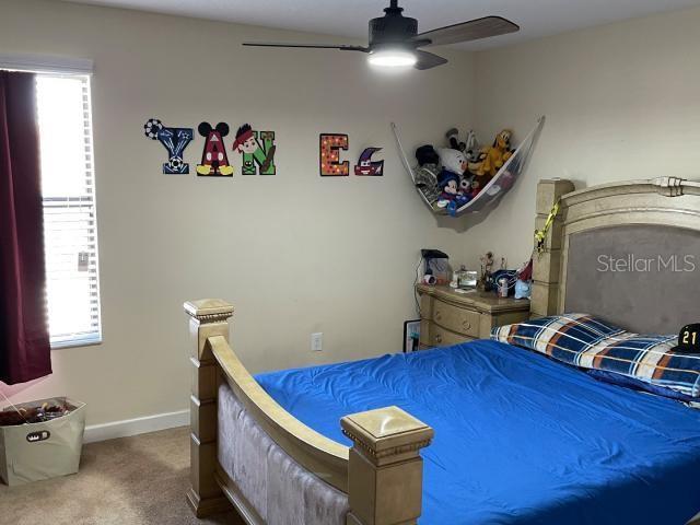 bedroom featuring carpet floors and ceiling fan