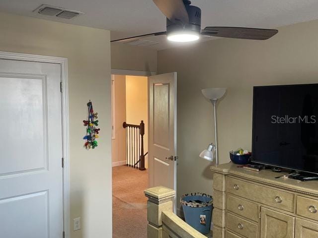 carpeted bedroom with ceiling fan