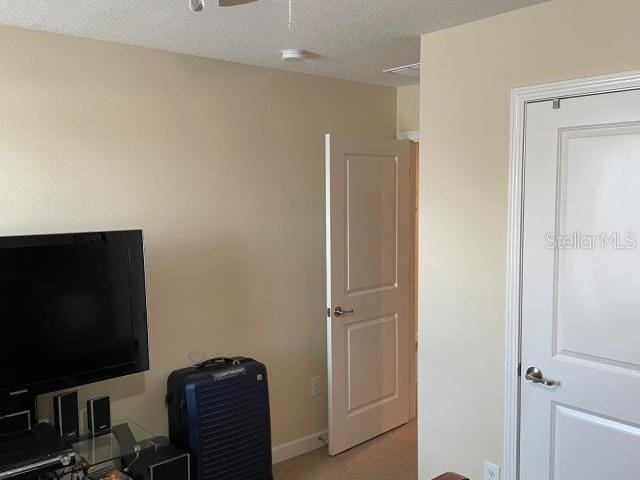 office featuring a textured ceiling and ceiling fan