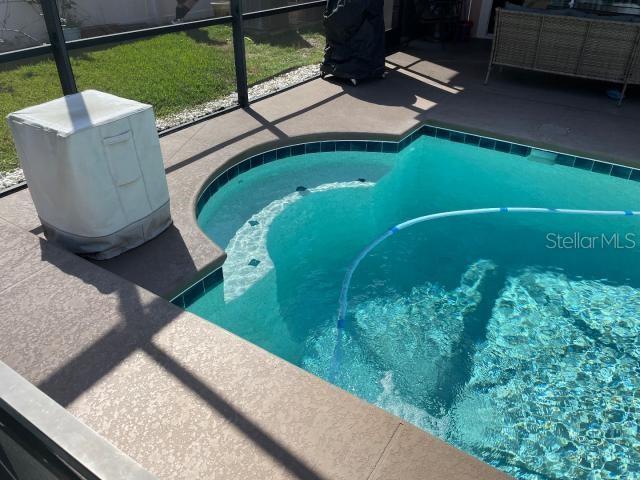 view of pool featuring a lanai