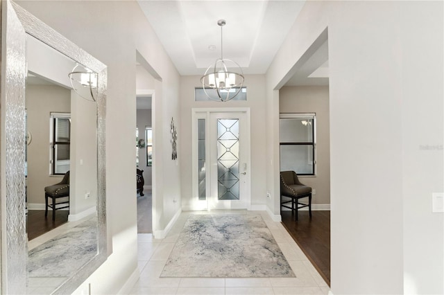 5074 Surfside Cir, Bradenton, FL 34211 - entrance foyer featuring a chandelier and tile patterned flooring