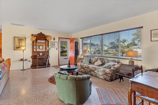 living room with a textured ceiling