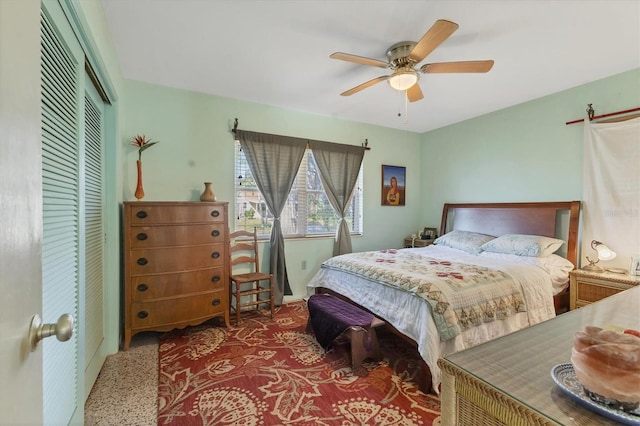 bedroom featuring ceiling fan, a closet, and carpet