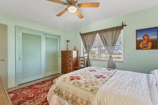 bedroom featuring ceiling fan and a closet