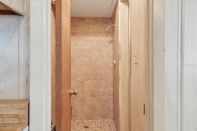 bathroom with tiled shower