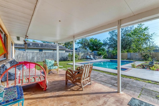 view of patio / terrace with a fenced in pool