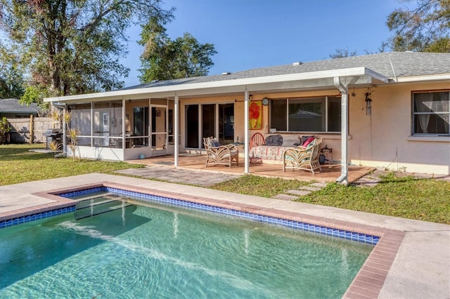 rear view of house with a fenced in pool, a yard, a patio area, and a sunroom