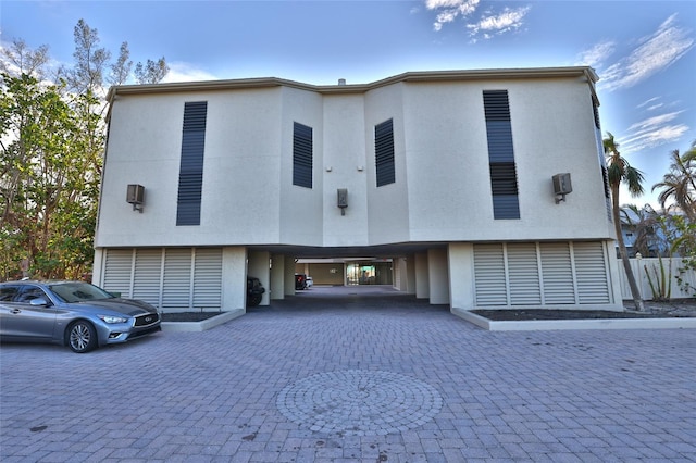 view of front of home featuring a carport