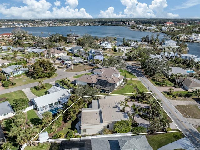 bird's eye view with a water view and a residential view