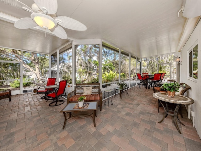 sunroom with a ceiling fan