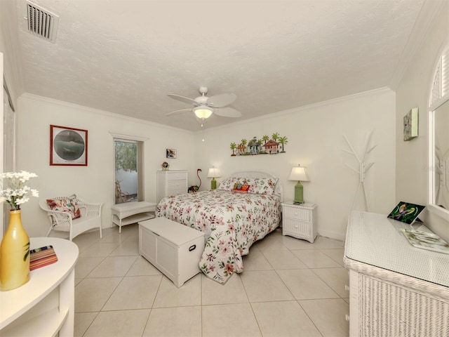 bedroom with a textured ceiling, light tile patterned floors, visible vents, and crown molding