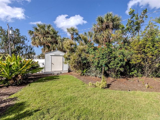 view of yard with a storage shed and an outdoor structure