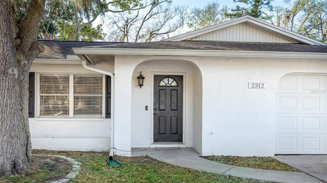 property entrance with a garage