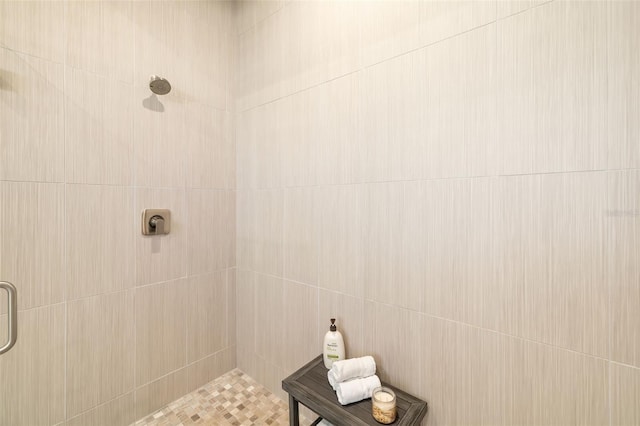 full bathroom with tiled shower