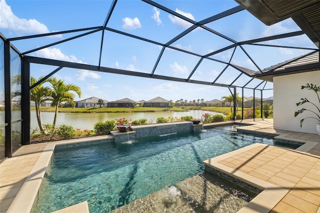 outdoor pool featuring glass enclosure, a water view, and a patio