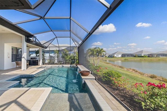 outdoor pool with glass enclosure, a patio area, a water view, and ceiling fan