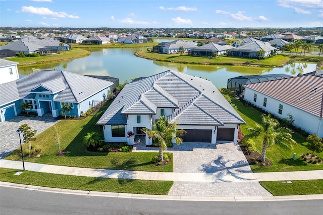 bird's eye view featuring a residential view and a water view