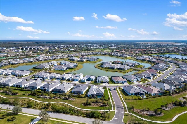 bird's eye view with a residential view and a water view