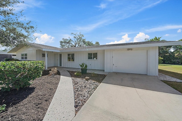 single story home featuring a garage