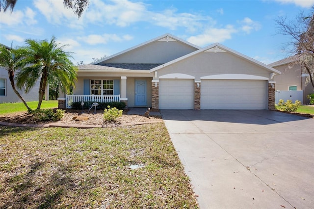 ranch-style home with a garage, a front yard, and covered porch