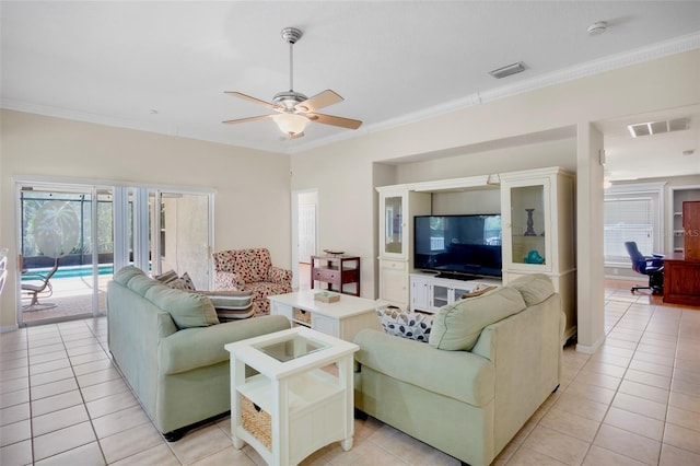 tiled living room featuring ornamental molding, a wealth of natural light, and ceiling fan