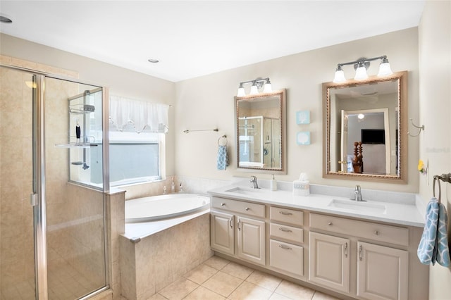 bathroom featuring plus walk in shower, tile patterned floors, and vanity