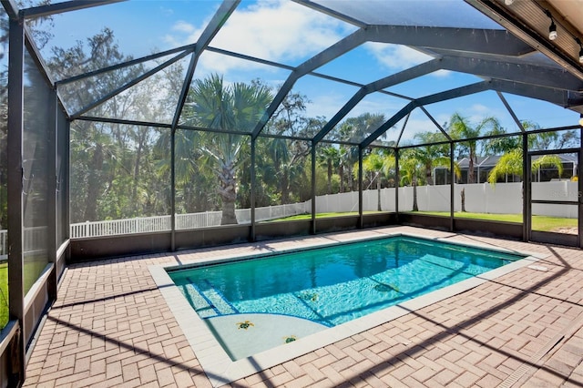 view of pool with a lanai and a patio