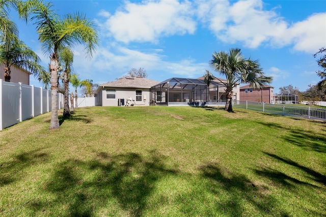 view of yard featuring glass enclosure