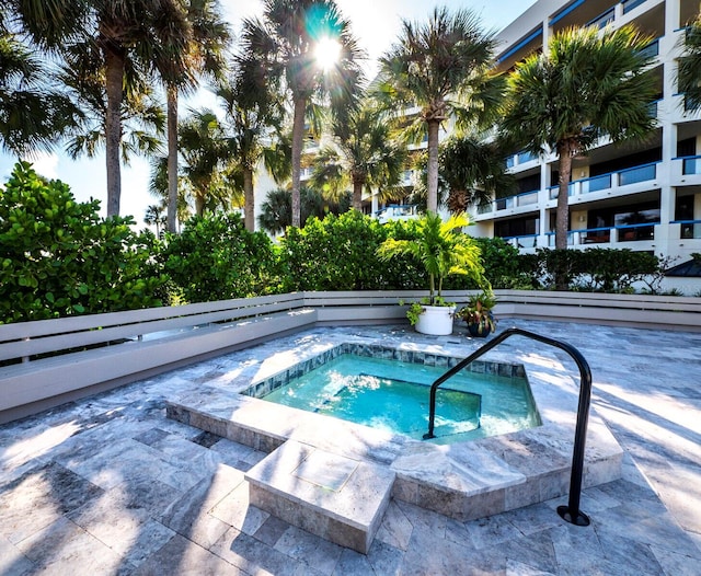 view of pool with a community hot tub