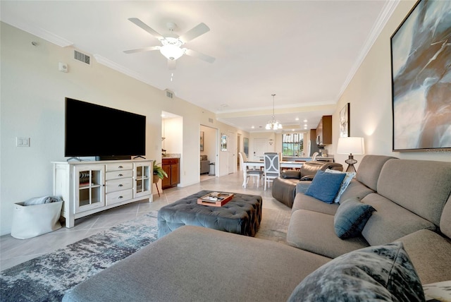 living room with light tile patterned floors, crown molding, and ceiling fan with notable chandelier